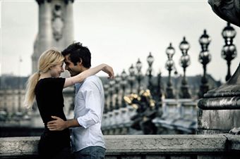 Couple on bridge in paris