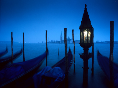 Mysterious Venice at night with gondolas